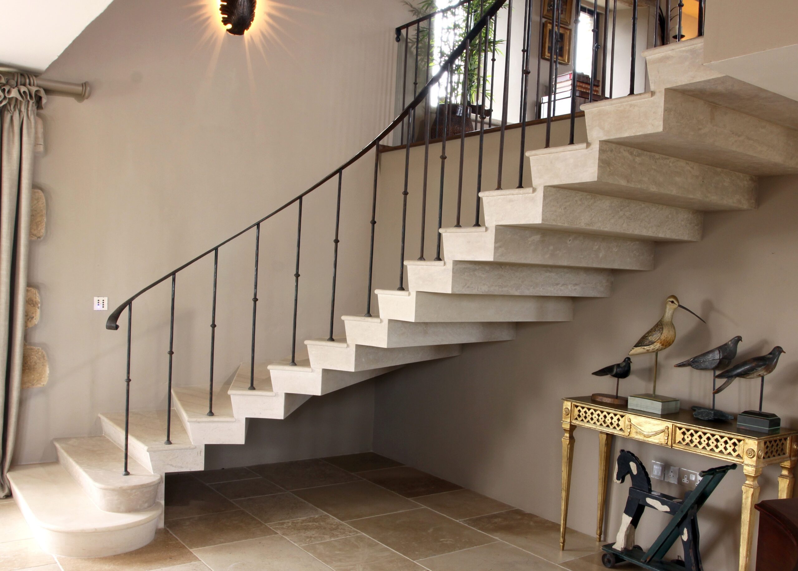18. Cantilever Roche Marron stone staircase with stepped soffit in a barn conversion – Cotswolds