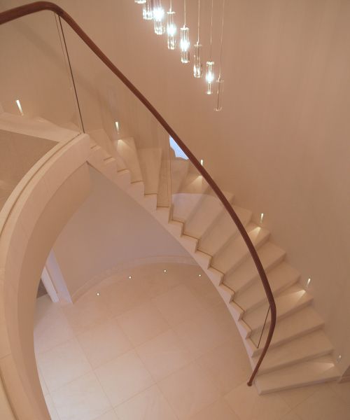 24. Malone stone cantilever staircase with glass balustrade and walnut handrail – Hertfordshire