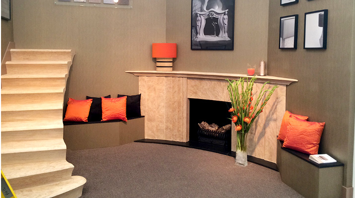 stone fireplace and stone staircase display - decorex