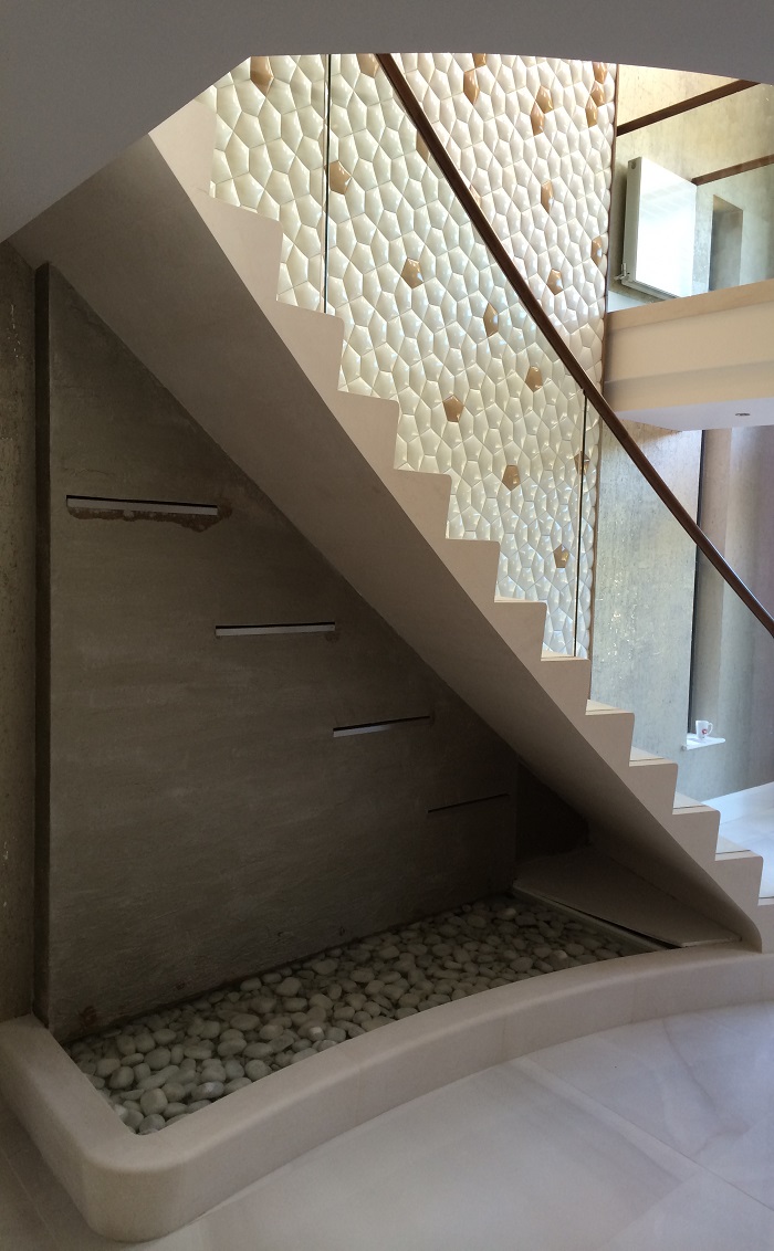 60. Moleanos staircase with glass balustrade, walnut handrail and water feature – Preston